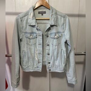 Distressed denim jacket.